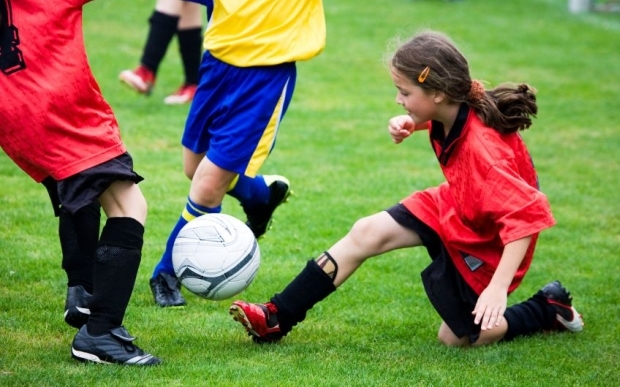Girl playing soccer